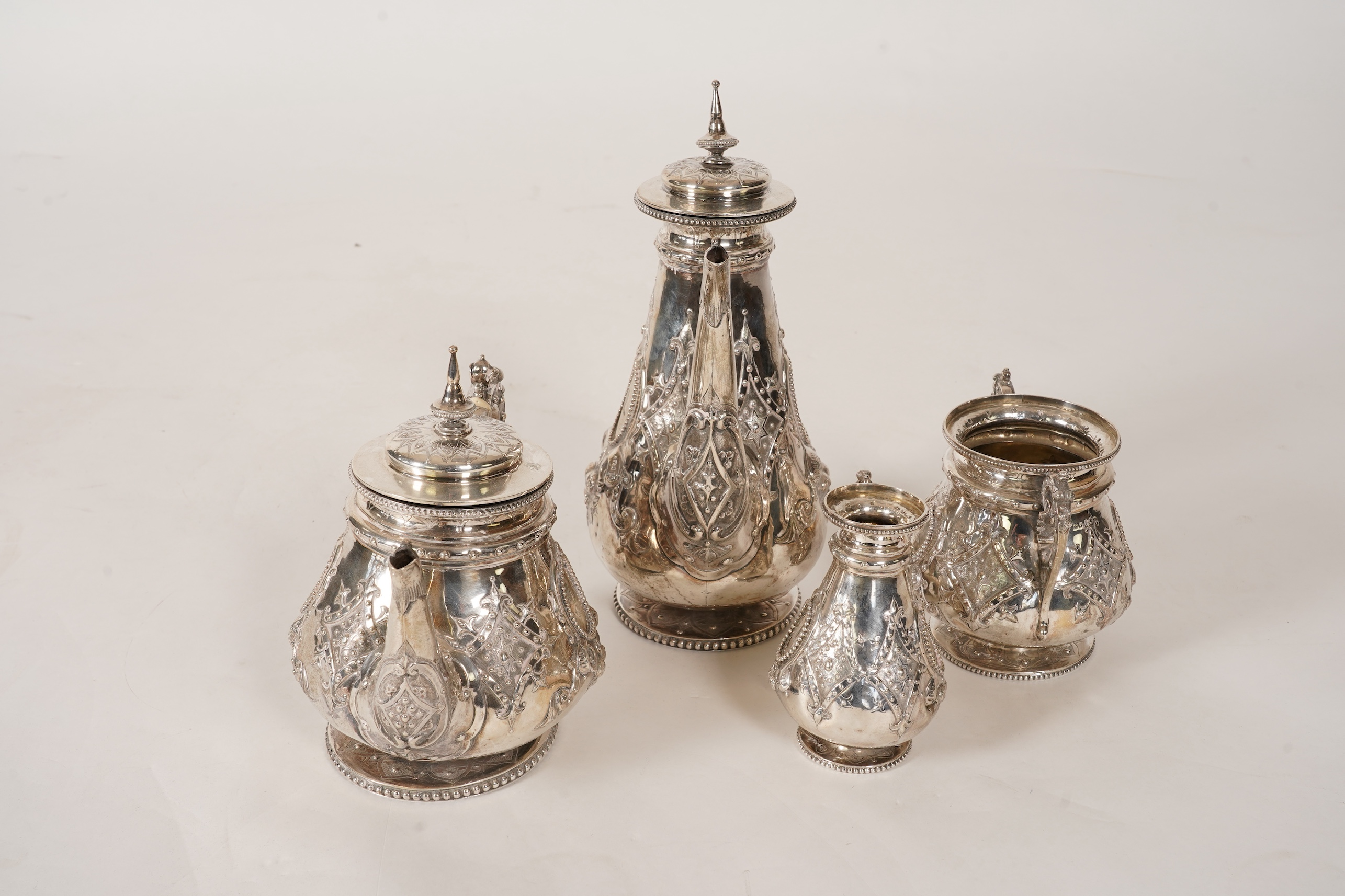 A Victorian ornate silver four piece tea and coffee service, by Thomas Smily
